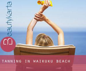 Tanning in Waikuku Beach